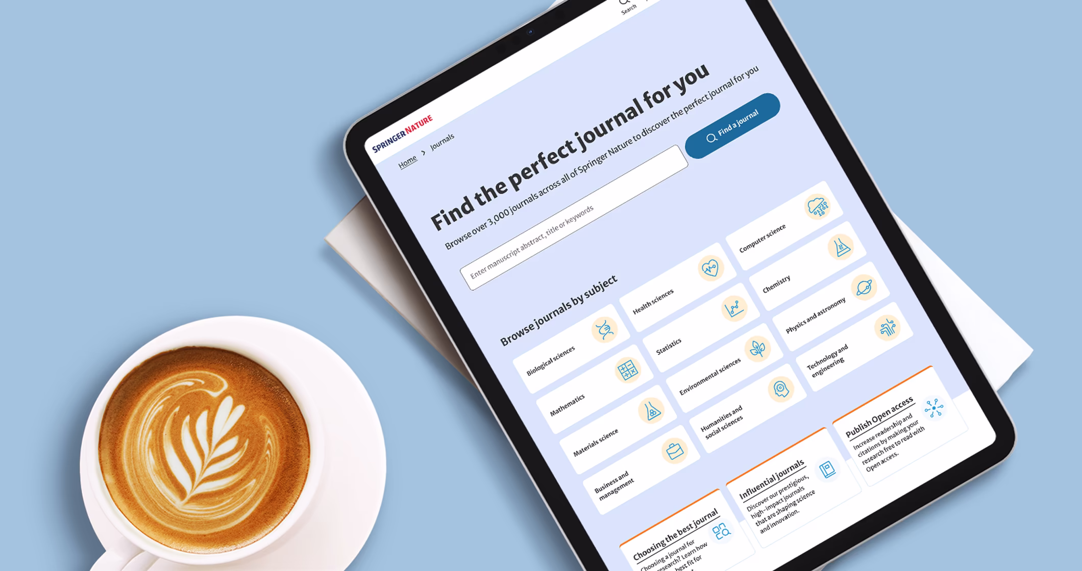 Photo of a coffee cup on a desk and an iPad with the Journal Finder interface